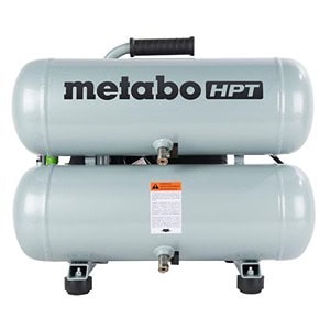 Front view of a Metabo HPT air compressor with dual stacked tanks and a handle on top, available at Scott's Hill Hardware. The compressor features an attached label with safety information.