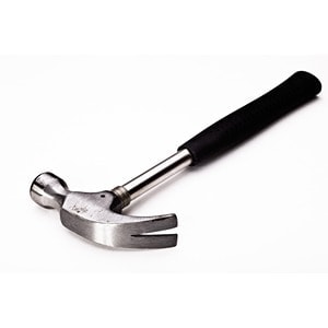 A metal claw hammer with a black rubber handle, designed for driving and removing nails, is shown on a white background. Available exclusively at Scott's Hill Hardware.